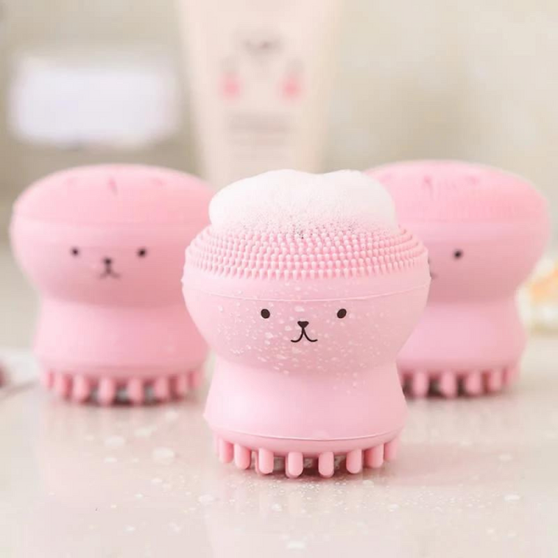 Cute pink silicone face cleansing brush for gentle exfoliationAdorable bear-shaped facial scrubber for deep cleansing