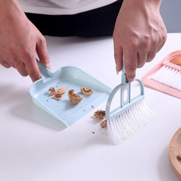 Compact and colorful mini broom and dustpan set for easy storage.